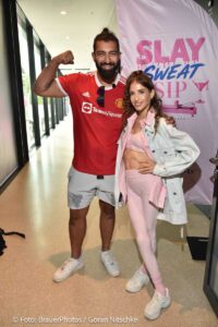 Cathy Hummels, Faisal Kawusi beim Event Cathylates Reformer Pilates - Cathy Hummels präsentiert ihre neue Lifestyle Marke im Restaurant Coubertin im Olympiapark in München am 22.08.2026 / Foto: BrauerPhotos / G. Nitschke